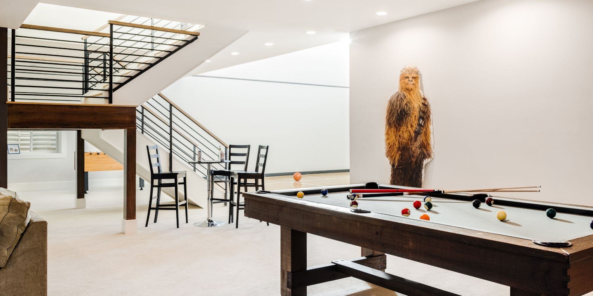 basement remodel in Boulder colorado with pool table and basketball court and chewbaca