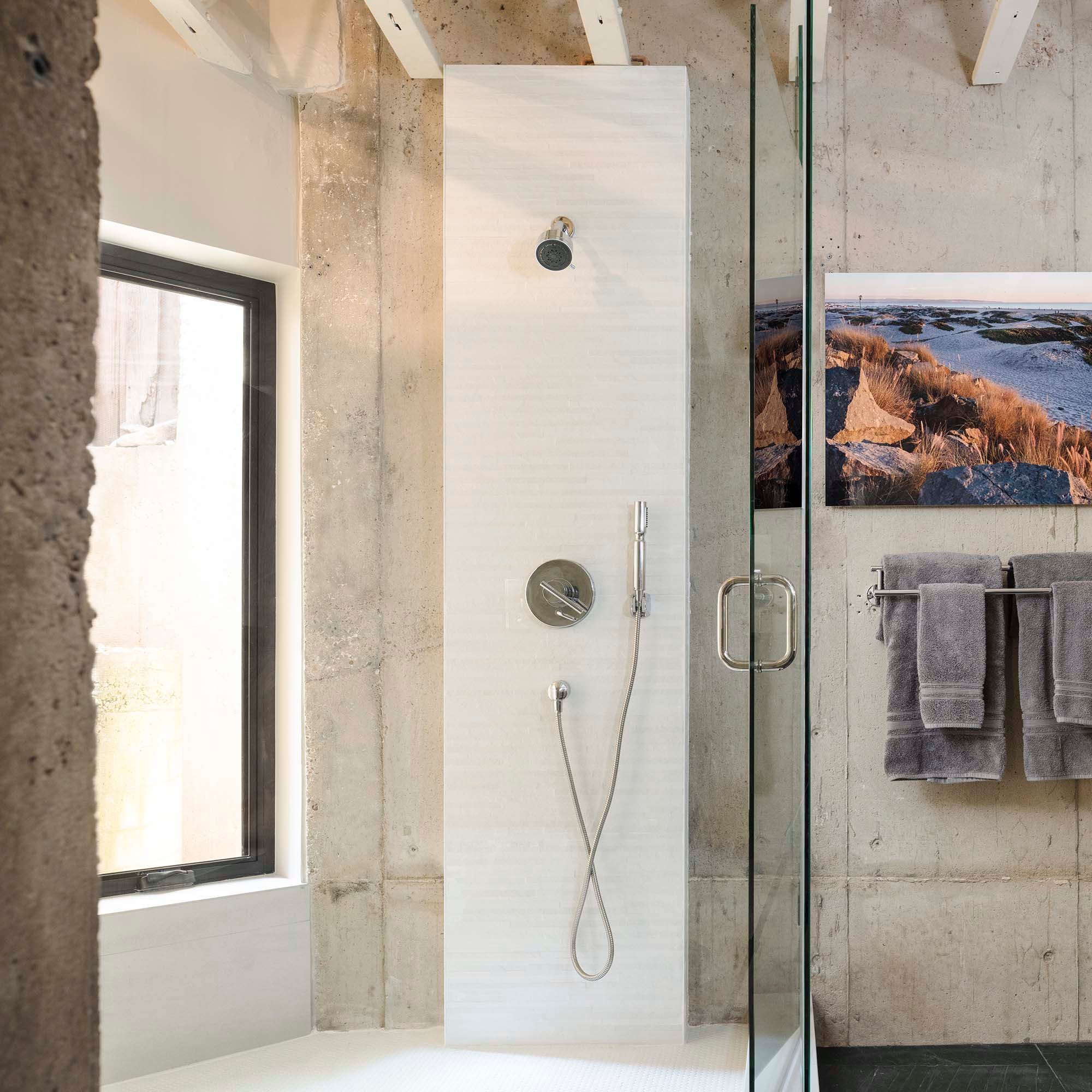 Norwood shower with stone wall and large window