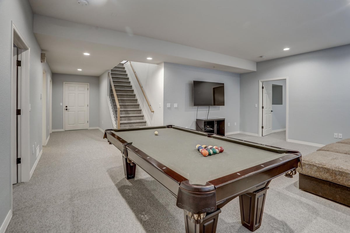 Basement with Pool Table and White Interior