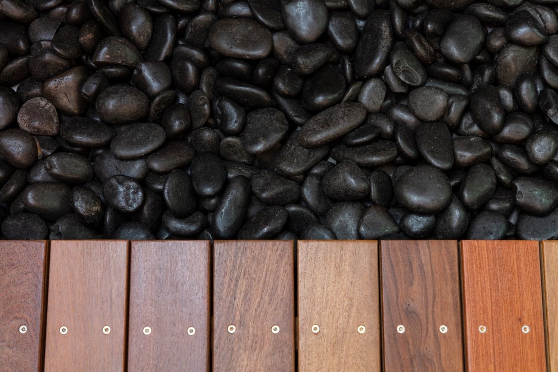 detail shot with lava rock and wood floor plank