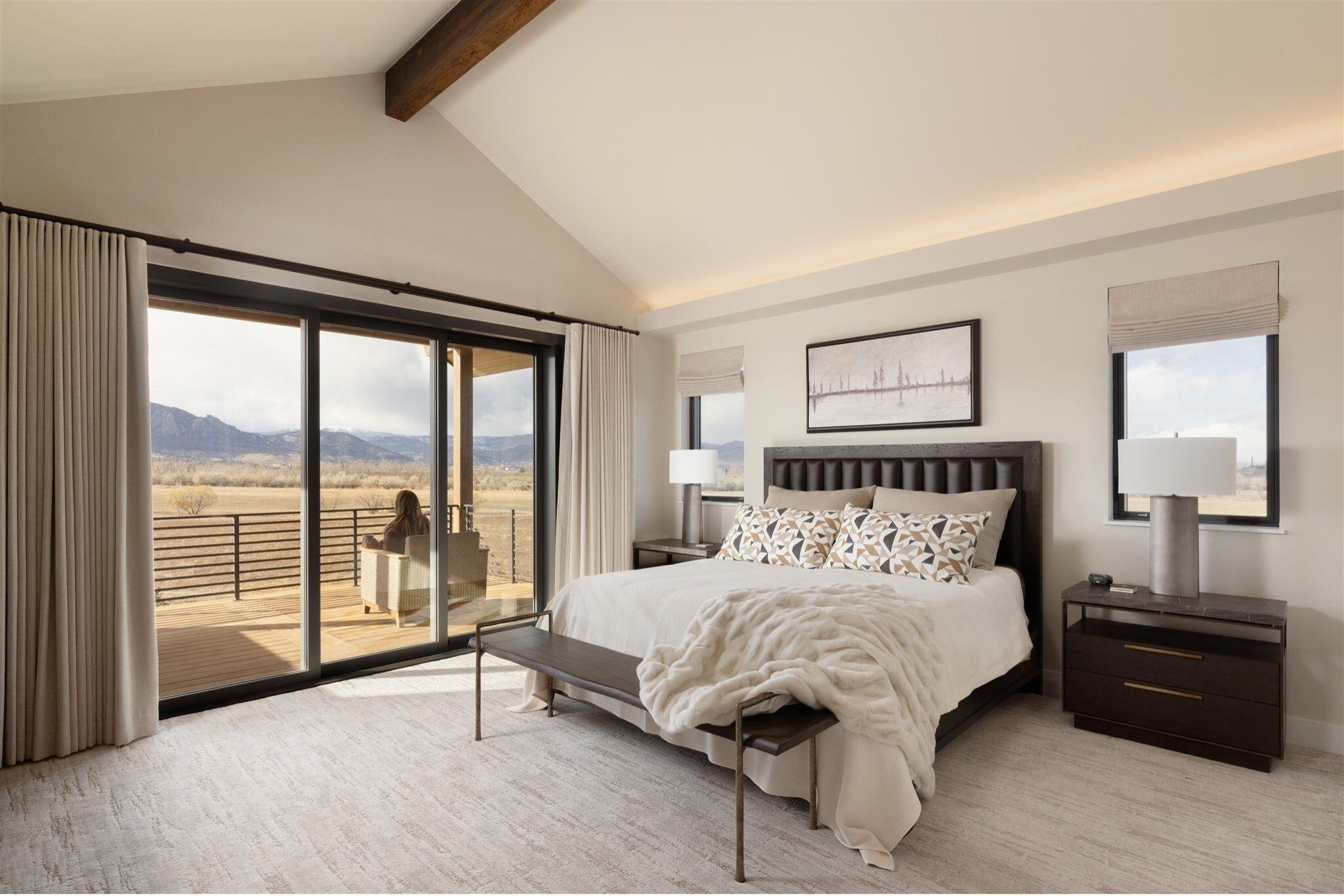 luxury bedroom in boulder colorado with balcony access to mountain views