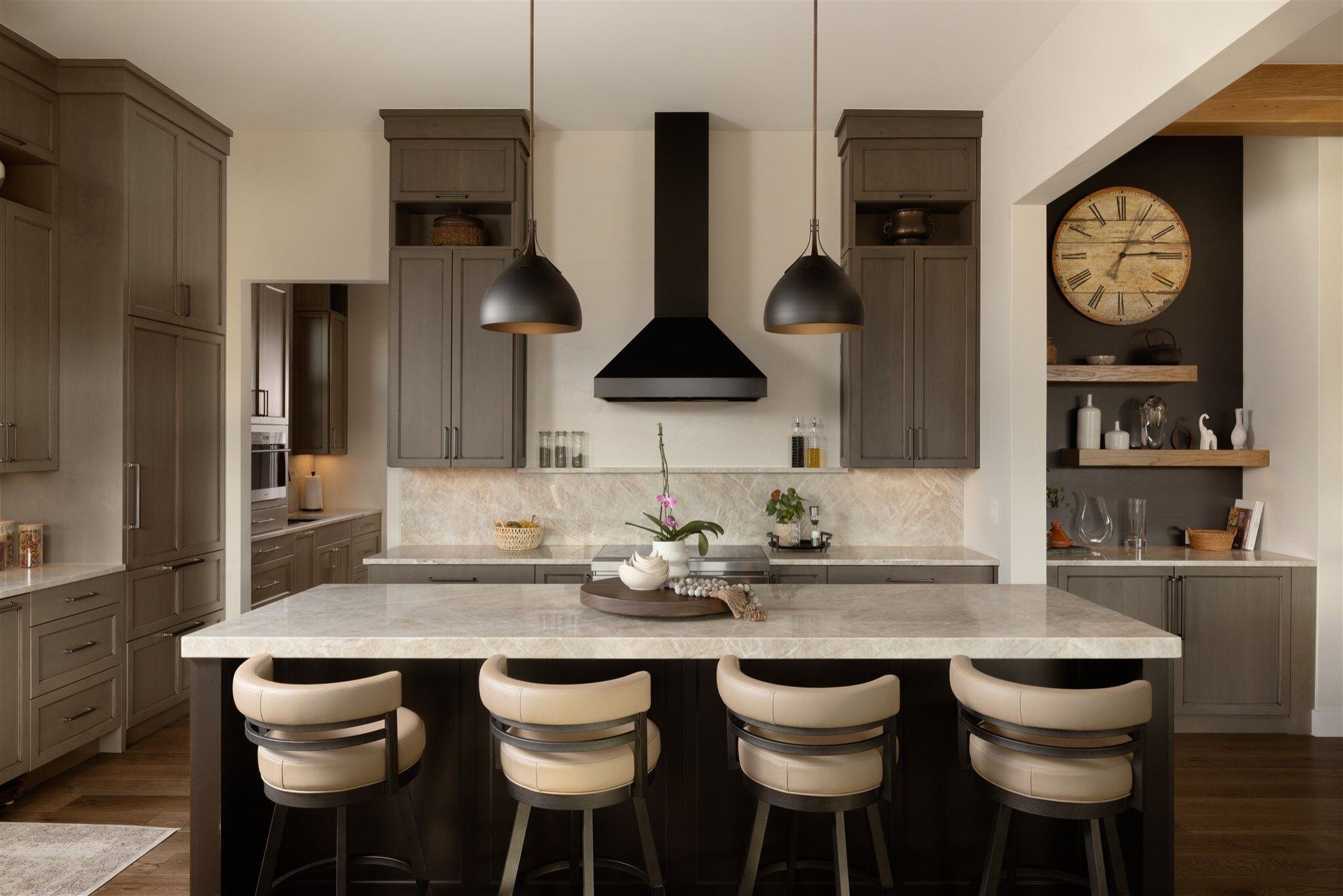 luxury kitchen in boulder colorado with kitchen island, bar stool seating, and brown cabinets