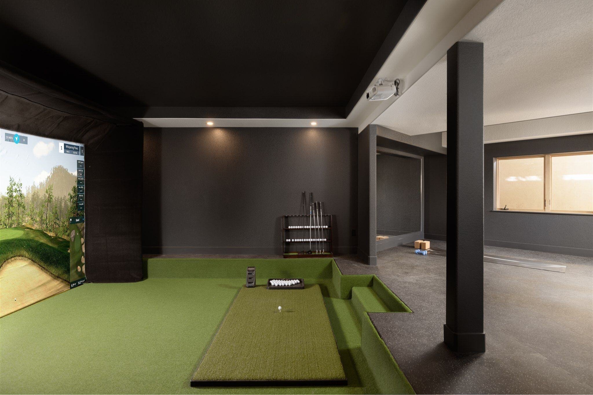 golf simulator in a basement remodel in boulder colorado