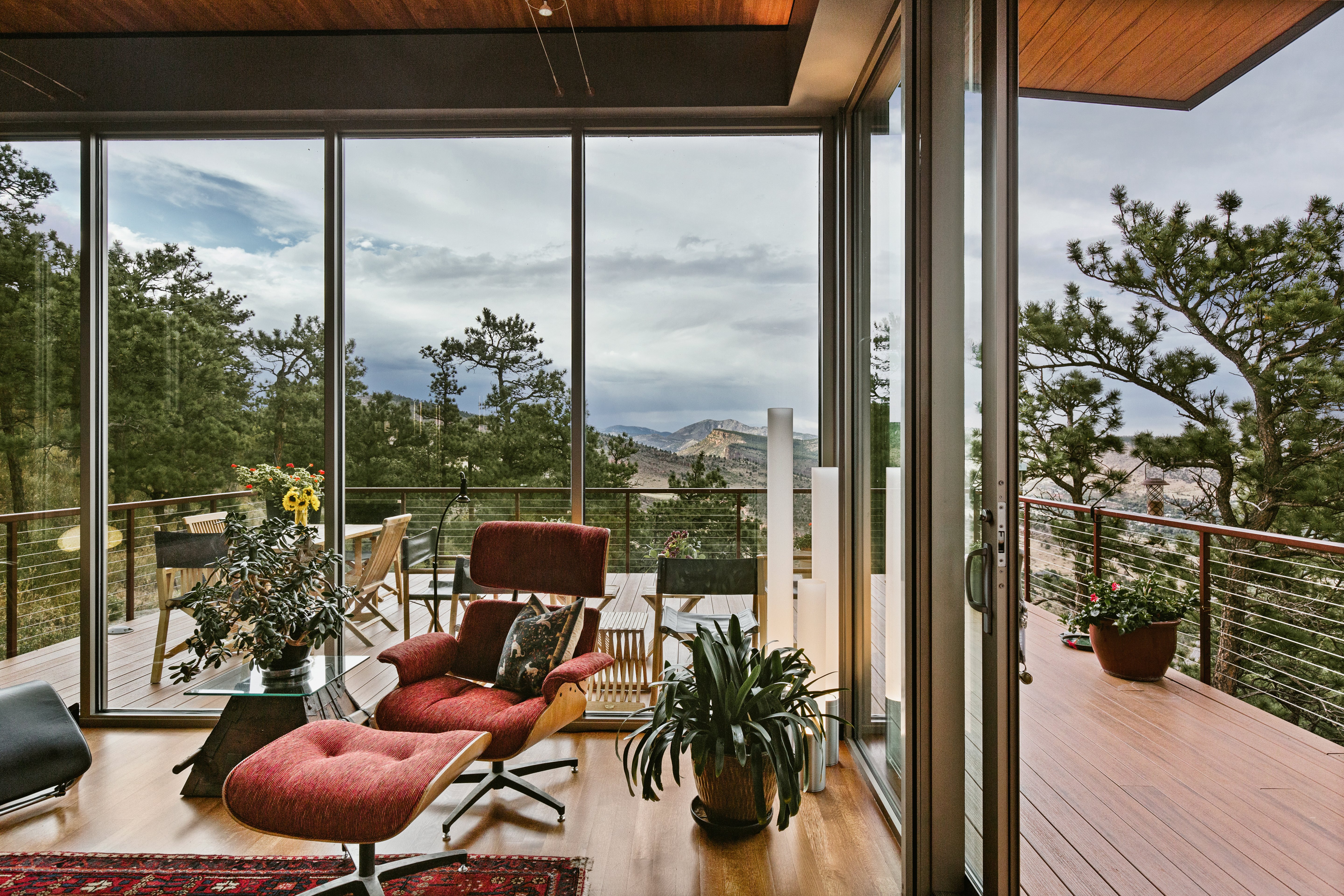 floor to ceiling windows with mountain view from living room
