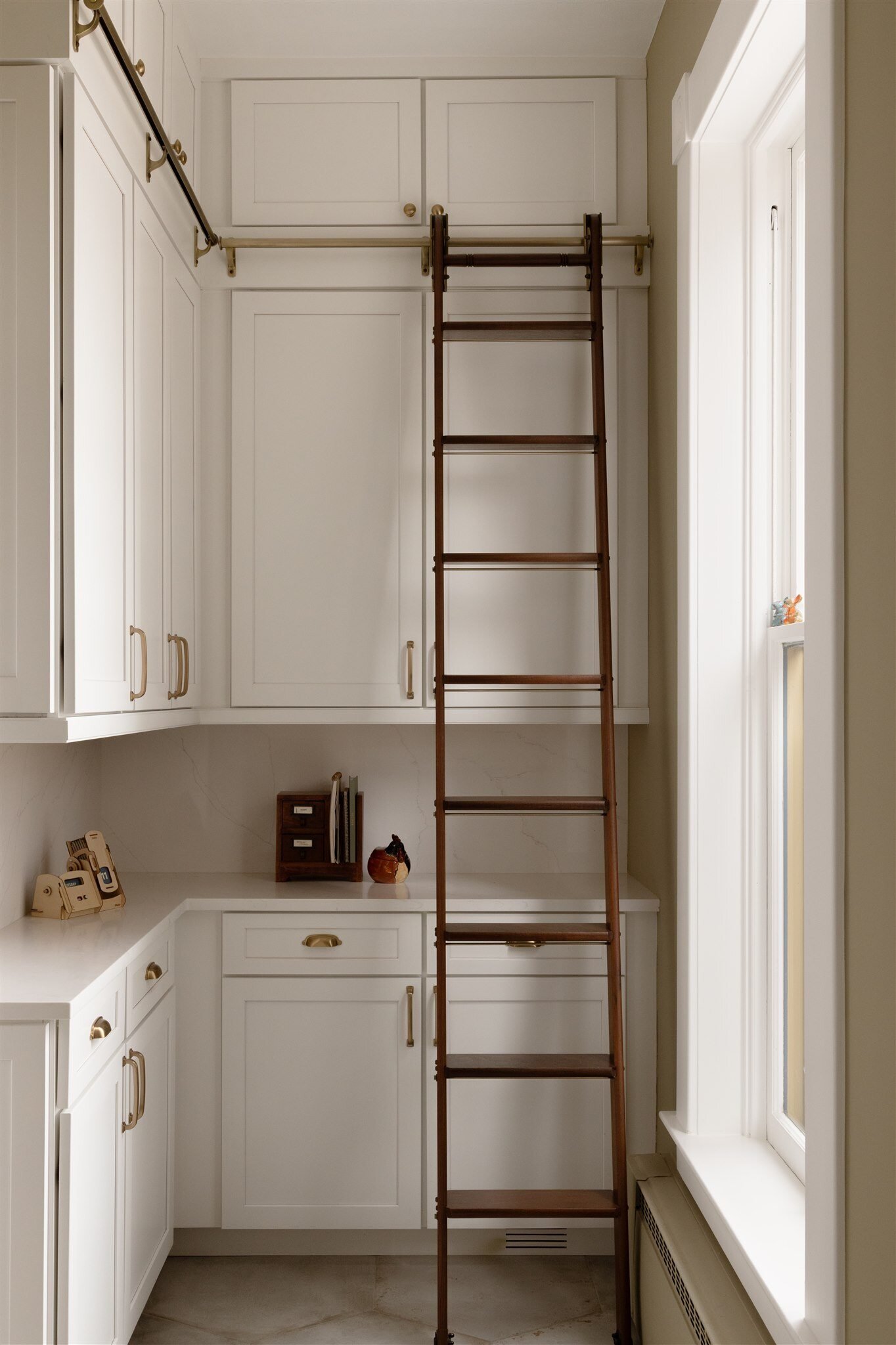 butler pantry with a ladder