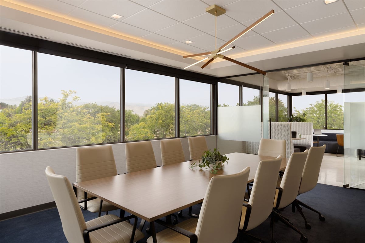 Colorado office meeting room with windows looking out to trees