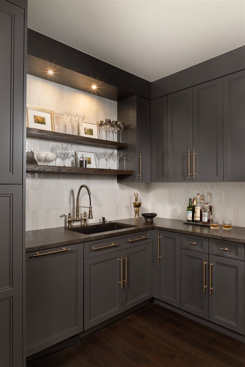 Butler's pantry with dark cabinets, open shelving with custom lighting and hold hardware